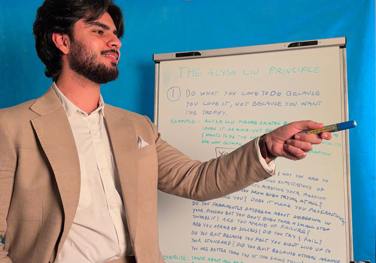 A student raising their hand to ask a question during a session